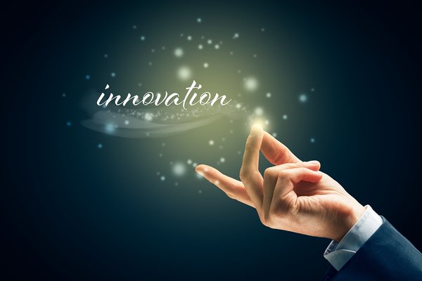 Person snapping their fingers under the word innovation.