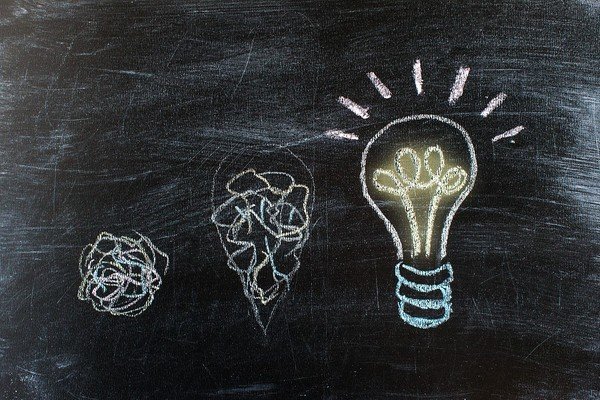 Lightbulbs drawn on a chalkboard.