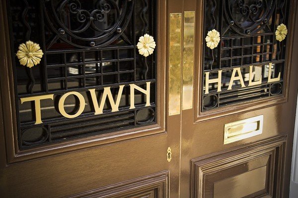Wooden entry doors labeled Town Hall.