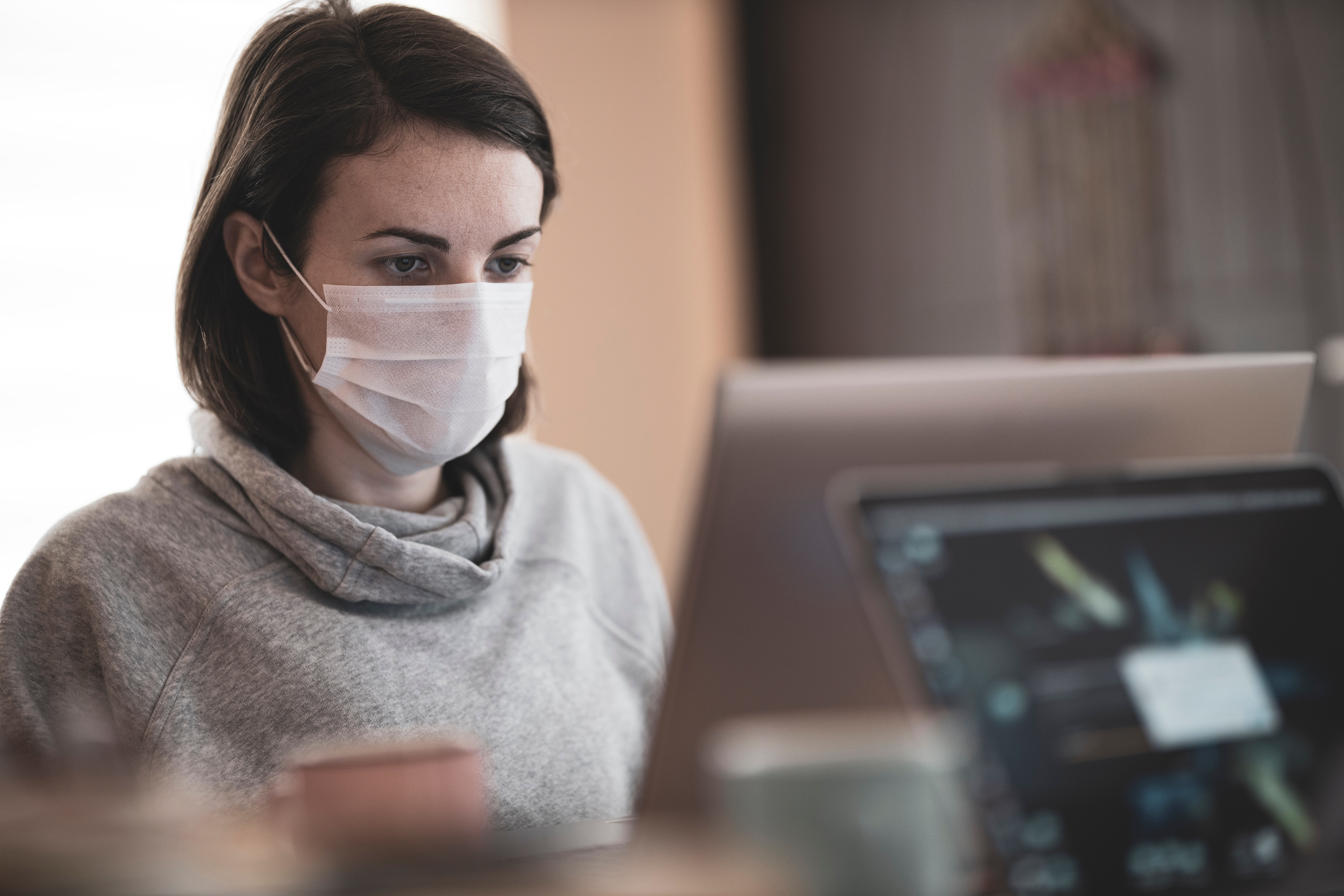 Group of colleagues wearing personal protection masks.